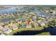 Community aerial view of waterfront homes each with pools, lawns, and a central pin at 7388 John Hancock Dr, Winter Garden, FL 34787