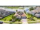 Aerial view of a beautiful home with a tile roof and waterfront views at 7388 John Hancock Dr, Winter Garden, FL 34787