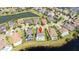 Aerial view of homes along a lake with manicured lawns and a central pin at 7388 John Hancock Dr, Winter Garden, FL 34787