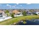 Stunning aerial view showcasing a luxurious home, pool, and scenic waterfront at 7388 John Hancock Dr, Winter Garden, FL 34787