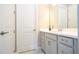 Bright bathroom with a white vanity, modern fixtures, and a clean, minimalist design at 7388 John Hancock Dr, Winter Garden, FL 34787