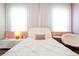 Serene bedroom featuring a plush bed, soft lighting, and cozy seating area at 7388 John Hancock Dr, Winter Garden, FL 34787