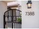Charming gated entrance with stone walkway and manicured garden at 7388 John Hancock Dr, Winter Garden, FL 34787