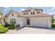 Beautiful home featuring a three car garage, tile roof and brick paved driveway at 7388 John Hancock Dr, Winter Garden, FL 34787