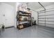 Garage with shelving and epoxy flooring providing organized storage space and durability at 7388 John Hancock Dr, Winter Garden, FL 34787