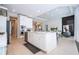 Bright, open kitchen featuring a large island with white cabinets and stainless steel appliances at 7388 John Hancock Dr, Winter Garden, FL 34787