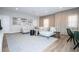 Spacious living room features a large sectional sofa, modern lighting, and stylish decor at 7388 John Hancock Dr, Winter Garden, FL 34787