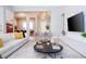 Elegant living room with contemporary decor, plush seating, and stylish lighting at 7388 John Hancock Dr, Winter Garden, FL 34787