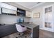 This office features a gray desk, chair, cabinets, shelves and a glass door at 7388 John Hancock Dr, Winter Garden, FL 34787