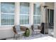 Comfortable patio seating and a modern heater on a paved surface next to the house at 7388 John Hancock Dr, Winter Garden, FL 34787