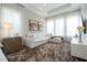Cozy sitting area featuring a comfortable sectional sofa, modern decor, and ample lighting at 7388 John Hancock Dr, Winter Garden, FL 34787