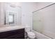 Bright and clean bathroom featuring granite counters, tile floors, and a shower/tub combo with sliding glass doors at 7557 Azalea Cove Cir, Orlando, FL 32807