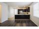 Kitchen featuring dark brown cabinets, stainless steel appliances and a breakfast bar at 7557 Azalea Cove Cir, Orlando, FL 32807