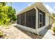 Enclosed screened-in patio offering a relaxing space with privacy and shade at 7557 Azalea Cove Cir, Orlando, FL 32807