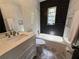 Beautiful bathroom featuring white subway tiles and modern fixtures at 7709 Ravenna Ave, Orlando, FL 32819