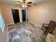 Bedroom with marble tile floors, peach walls and black closet doors at 7709 Ravenna Ave, Orlando, FL 32819