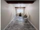 Dining room with a window, exposed beam ceiling, and marble floors at 7709 Ravenna Ave, Orlando, FL 32819