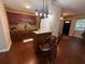 Kitchen with granite countertops, dark wood cabinets and bar seating at 7709 Ravenna Ave, Orlando, FL 32819