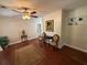 Inviting living room featuring hardwood floors, elegant furnishings, and a ceiling fan at 7709 Ravenna Ave, Orlando, FL 32819