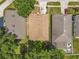 Aerial view of home showing roof, lawn and surrounding houses at 7939 Riffle Ln, Orlando, FL 32818
