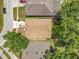 Aerial view of home showing the roof, lawn and surrounding area at 7939 Riffle Ln, Orlando, FL 32818