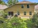 Back of the home with a sliding glass door to the patio at 7939 Riffle Ln, Orlando, FL 32818