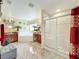 Bright bathroom featuring a shower, jacuzzi tub, granite countertops, and tile floors at 7939 Riffle Ln, Orlando, FL 32818