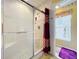 A neutral shower featuring a glass door and a built-in seat is next to the tub at 7939 Riffle Ln, Orlando, FL 32818