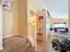 Upstairs hallway view looking into an open-plan dining and living space at 7939 Riffle Ln, Orlando, FL 32818