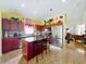 Stylish kitchen featuring stainless appliances, granite countertop island, and a warm, inviting atmosphere at 7939 Riffle Ln, Orlando, FL 32818