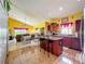 Spacious kitchen with an island, countertops, and stainless steel appliances at 7939 Riffle Ln, Orlando, FL 32818