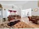 Living room with tile flooring, and decorative window treatments at 7939 Riffle Ln, Orlando, FL 32818