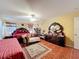 The main bedroom features a tile floor, dresser, seating area, and lots of space at 7939 Riffle Ln, Orlando, FL 32818