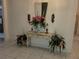 Foyer featuring elegant table and decorative floral arrangements at 8603 Snowfire Dr, Orlando, FL 32818