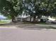Charming home with mature trees and well-manicured landscaping at 8603 Snowfire Dr, Orlando, FL 32818