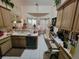 A cozy kitchen features a sink, appliances, tile flooring, and a casual dining area at 8603 Snowfire Dr, Orlando, FL 32818