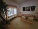 Inviting living room with large window and decorative accents at 8603 Snowfire Dr, Orlando, FL 32818