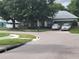 A ranch style house and driveway as viewed from across the street at 8603 Snowfire Dr, Orlando, FL 32818