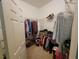 Walk-in closet with clothing rods, shelving, and a wide array of items at 8603 Snowfire Dr, Orlando, FL 32818