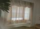 Inviting window seat with decorative cushions and curtains at 8603 Snowfire Dr, Orlando, FL 32818