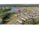 Aerial view of the property highlighting its location near a lake within a residential community at 873 Daring Dr, Davenport, FL 33837