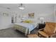 Cozy bedroom with a queen size bed, carpet flooring, and an ensuite bathroom at 873 Daring Dr, Davenport, FL 33837