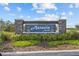 Astoria North community entrance sign featuring stone pillars and landscaped garden beds at 873 Daring Dr, Davenport, FL 33837