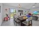 Open concept dining area with views of the backyard and seamlessly connected to the living room at 873 Daring Dr, Davenport, FL 33837