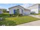 Inviting single-Gathering home with lush landscaping, green lawn, and a two-car garage at 873 Daring Dr, Davenport, FL 33837