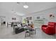 Modern living room with tile floors, sleek furniture, and lots of natural light at 873 Daring Dr, Davenport, FL 33837