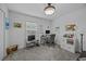 Bright home office space with modern desk, shelving, and ample natural light for productivity at 873 Daring Dr, Davenport, FL 33837