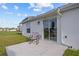 Relaxing patio with a chair; ideal for enjoying the outdoors and the peaceful surroundings at 873 Daring Dr, Davenport, FL 33837