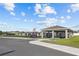 Community playground and pavilion for shade with benches and bike racks at 873 Daring Dr, Davenport, FL 33837