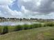 Picturesque pond view from the property, showing serene water and surrounding greenery at 873 Daring Dr, Davenport, FL 33837